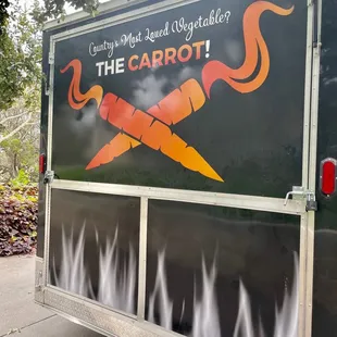 the logo on the side of a food truck