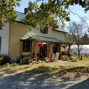 a white house with a green roof