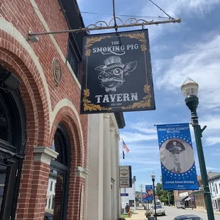 a sign for smoking pig tavern