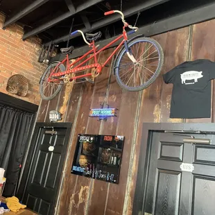a bicycle hanging from the ceiling