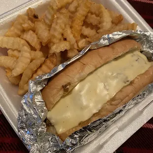 Cheesesteak and seasoned, crispy fries wrapped up to-go