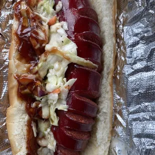 Smoked sausage roll with sauce &amp; slaw