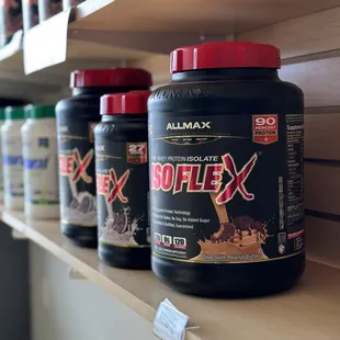 a row of bottles of protein