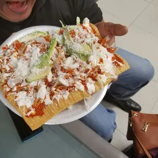 a man holding a plate of food