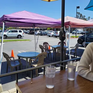 Outdoor seating (patio and part of the lot)