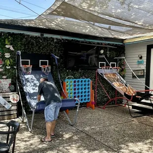 a man cleaning a patio