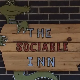 a crocodile on a sign