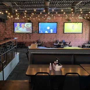 Seating Area with Bar and Golden Tee Games on the Left