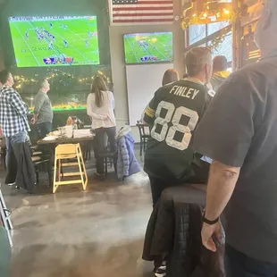 Everyone  stands for the  National Anthem...