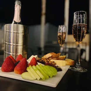 Cheese and fruit board and French rose