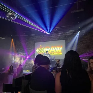 a group of people sitting at a bar