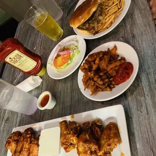 Wings, sweet potato fries and stuffed burger.