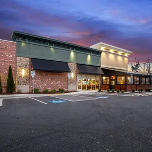 the exterior of a restaurant at dusk