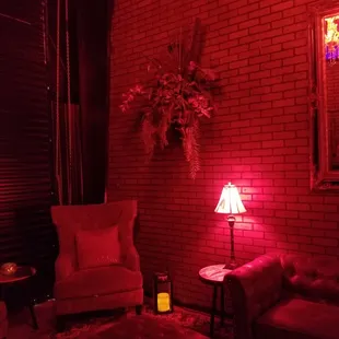 a living room with red lighting