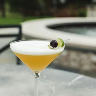 a cocktail in a martini glass