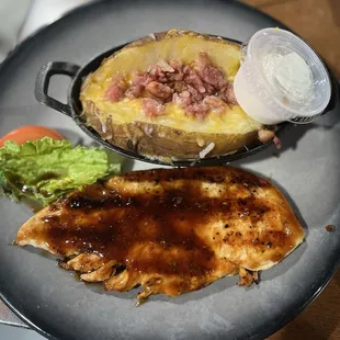 Teriyaki chicken with a baked potato.