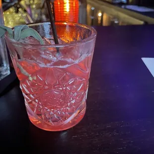 a drink in a glass on a bar