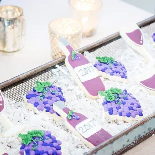 a tray of decorated cookies