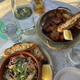 a plate of food and a glass of water