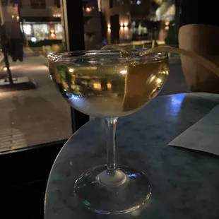 a glass of wine on a table