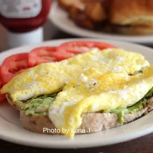 Avocado Toast ($14) - it&apos;s OK, needs more salt. Toast, avocado spread (lemon, sunflower seeds, red pepper flakes, garlic), egg.