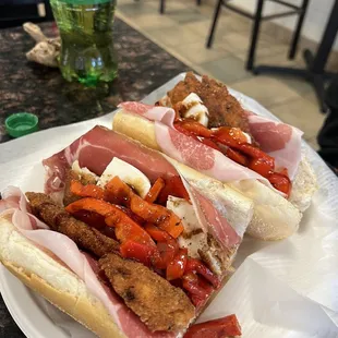 two sub sandwiches on a plate