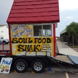 a food truck with a red roof