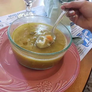 Hoping chicken noodle soup will sooth her cold.