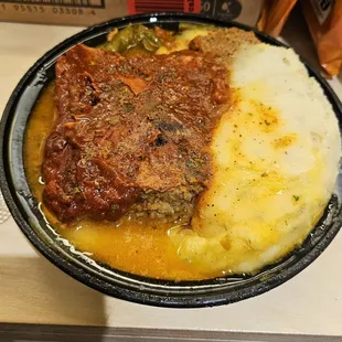 Meatloaf, mashed potatoes, and &quot;smothered&quot; green beans (they&apos;re under the meat loaf).