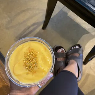 a person holding a bowl of food