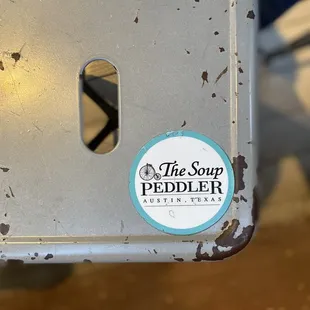a sticker on the back of a chair