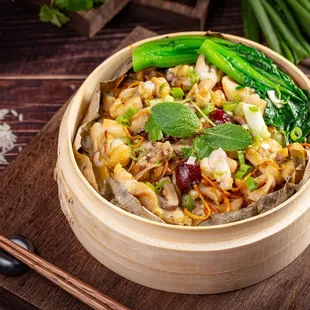 Steamed Rice in Lotus Leaf with Frog Meat, Dry Cordyceps Flower, and Dry Tangerine Peel