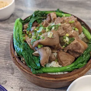 Steamed rice in lotus leaf with braised pork feet.