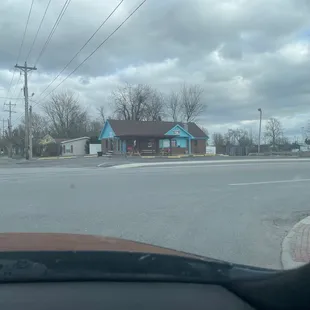 the intersection of a street and a house