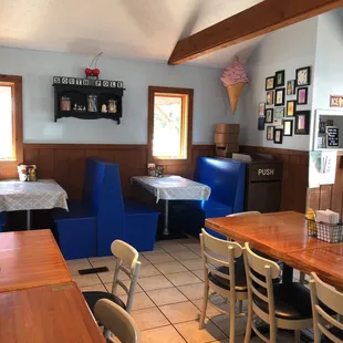 a restaurant with blue booths and tables