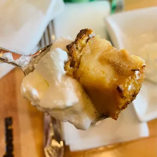 a spoon with a piece of cake on it