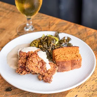 Buttermilk Fried Chicken with sweet potato cornbread, collards, honey-thyme gravy, bread &amp; butter pickles