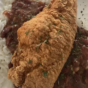 Jumbo Cajun seasoned catfish over red beans and rice.....