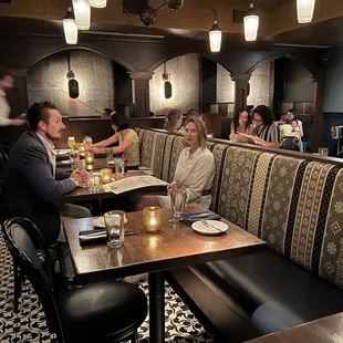 a group of people sitting at a restaurant