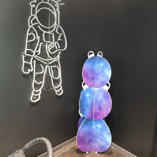 a spaceman hanging from the ceiling