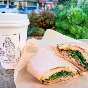 Moroccan panini - harissa sauce, EVOO, goat cheese, kalamata olives, sun dried tomatoes and arugula. Soooo yum!