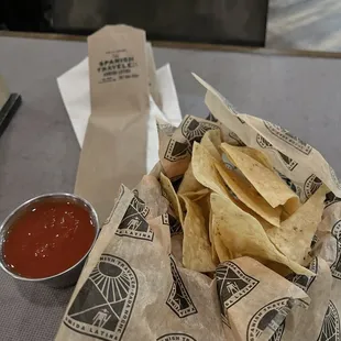 a tortilla and chips on a table
