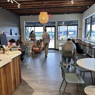 a group of people eating in a restaurant