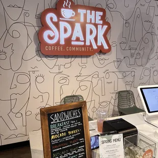 a coffee shop counter with a laptop on it