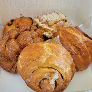 Ocean roll, cherry sausage croissant, pistachio croissant, cinnamon roll