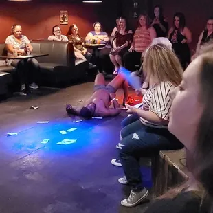 a group of people sitting and standing