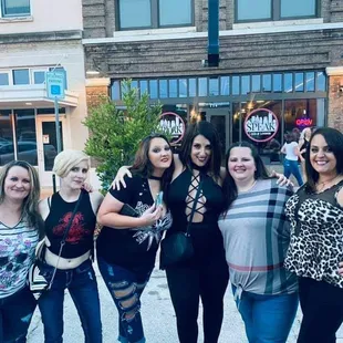 a group of women posing for a picture