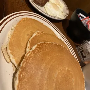 Pancake platter, 2 eggs over medium and sausage patties.
