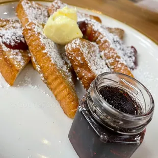 Brown Butter French Toast Whipped butter, strawberry cardamom jam, Paul Family Farm&apos;s maple syrup.