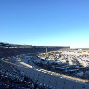 a large crowd of people watching a race